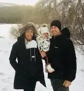 Aloha Mammoth hosts with their baby in the snow at Mammoth Lakes